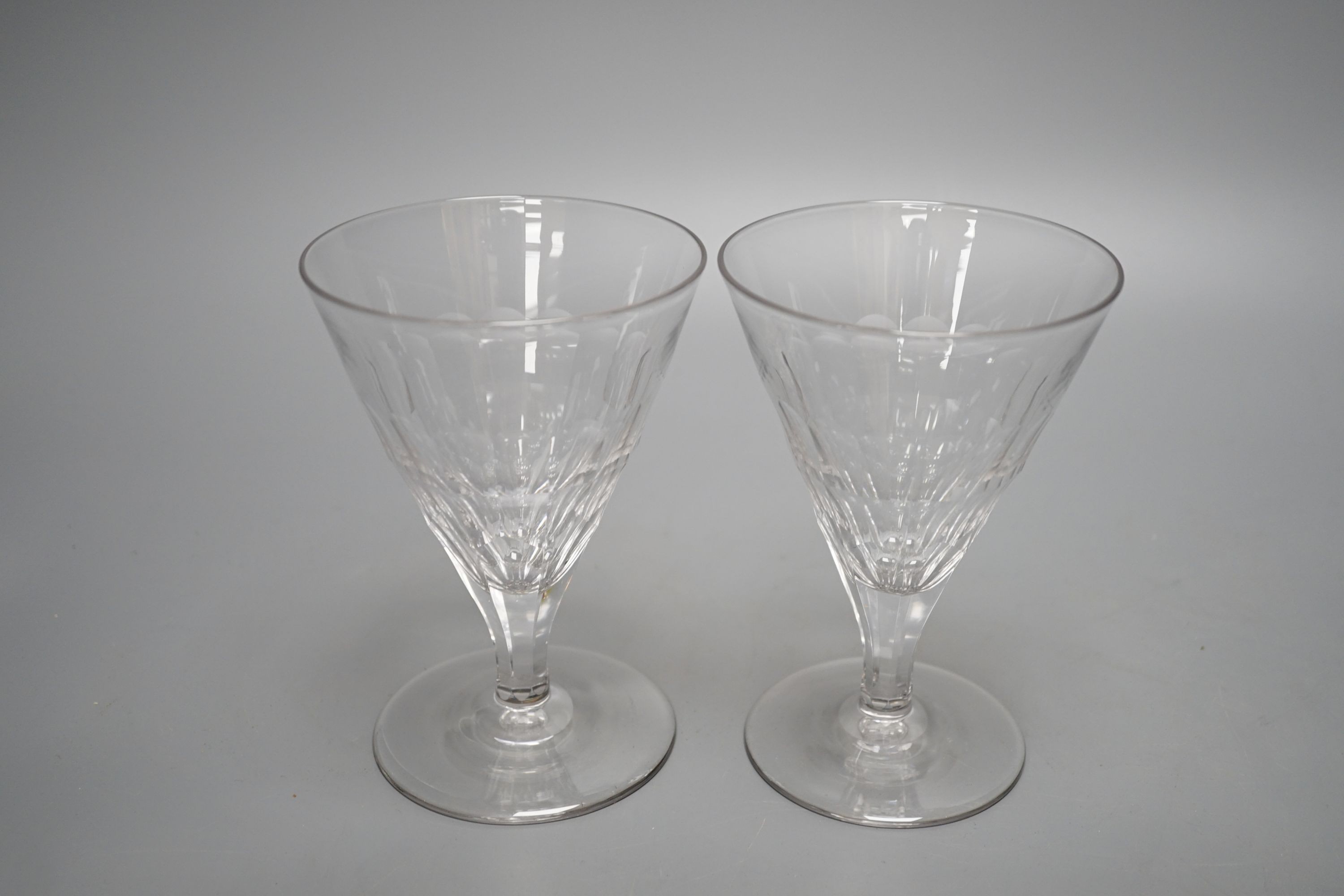 A set of ten facet cut conical wine glasses, 14cm